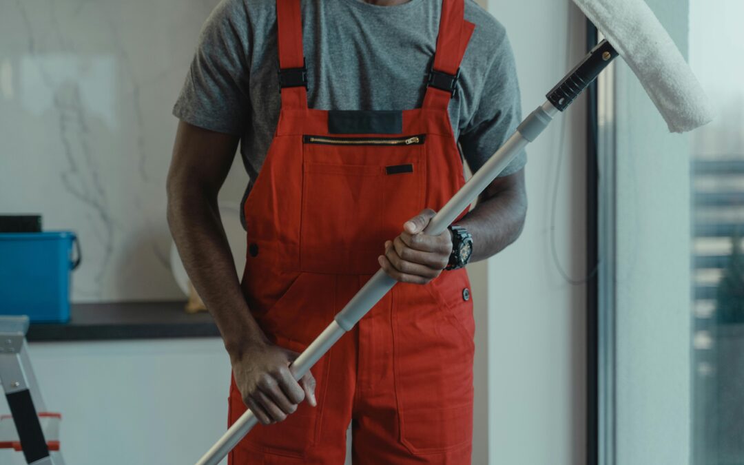 A person holding a cleaning tool